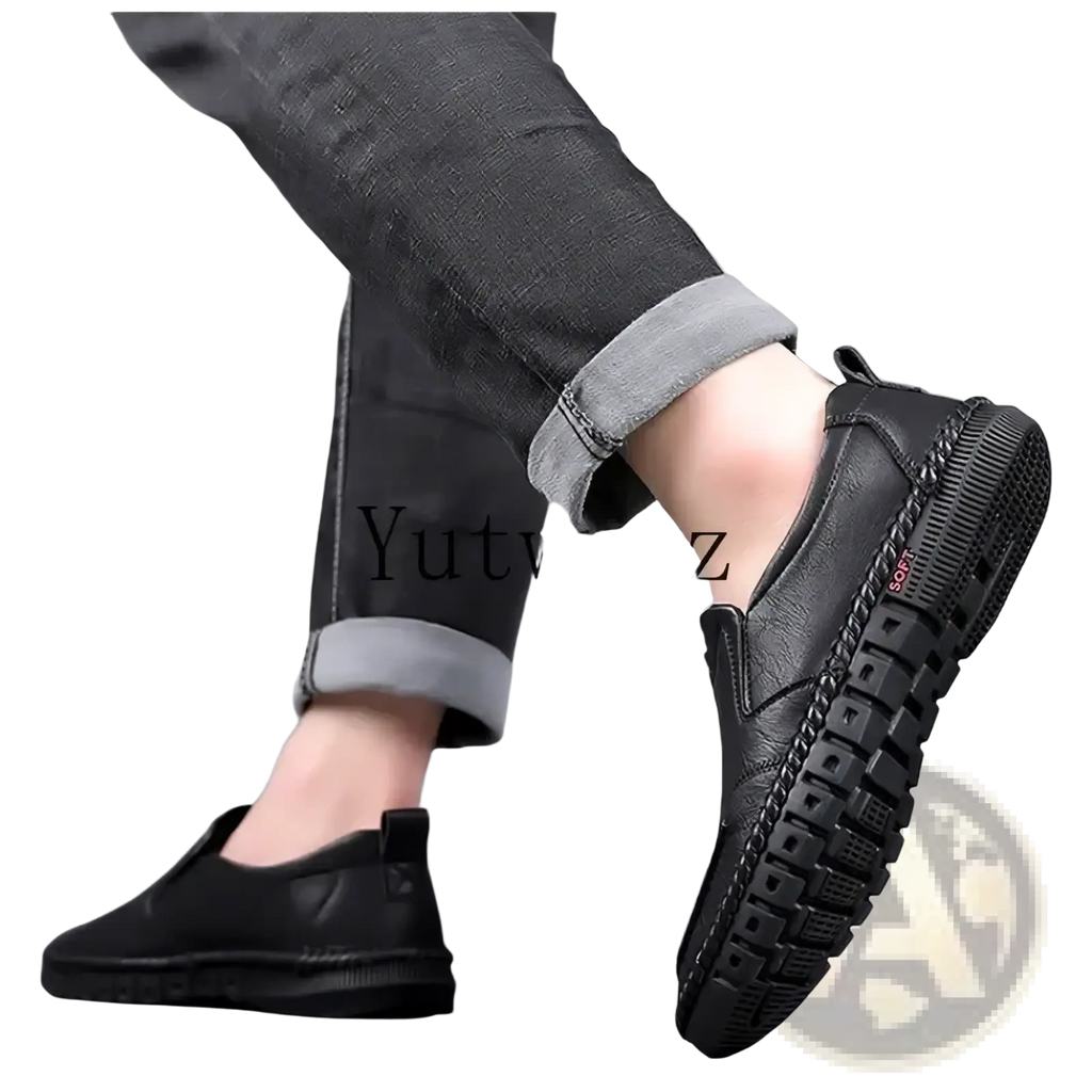 Men leather slip on dress shoes in black with textured chunky sole and red soft label on the side