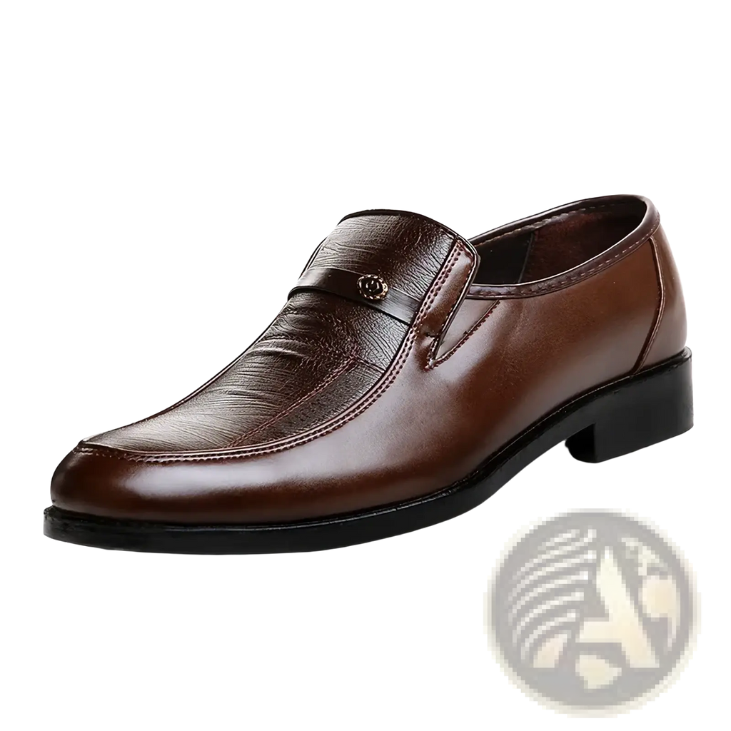Men leather slip on dress shoe in brown with subtle textured toe pattern and small metallic emblem on the strap