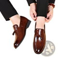 Men leather tassel loafers in brown leather with polished finish and classic design for formal use