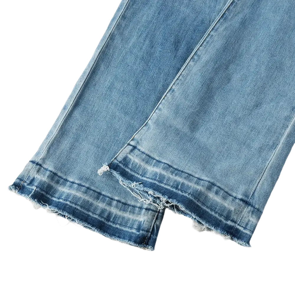 Men light blue bootcut jeans made of denim with frayed and distressed hems in a light wash finish