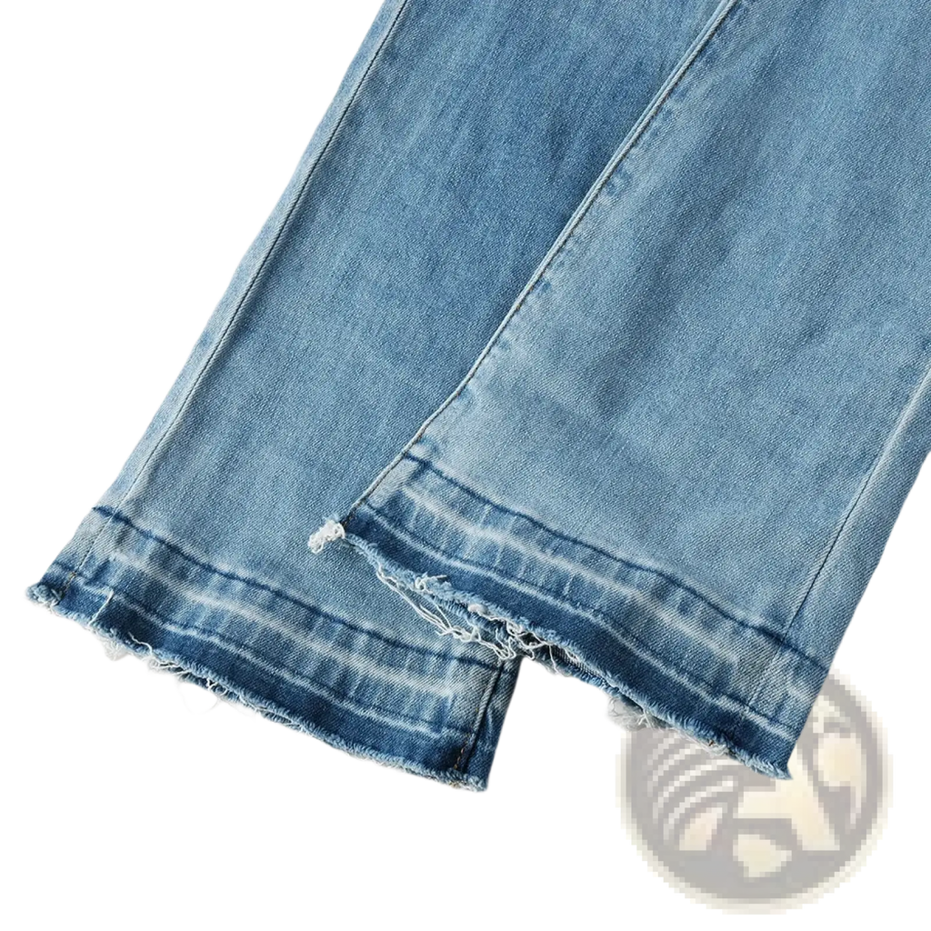 Men light blue bootcut jeans made of denim with frayed and distressed hems in a light wash finish