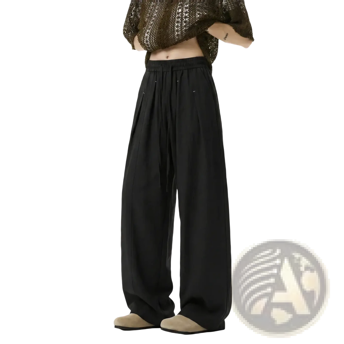 Men lightweight black wide-leg trousers with drawstring waist and subtle pleats in a relaxed flowing silhouette