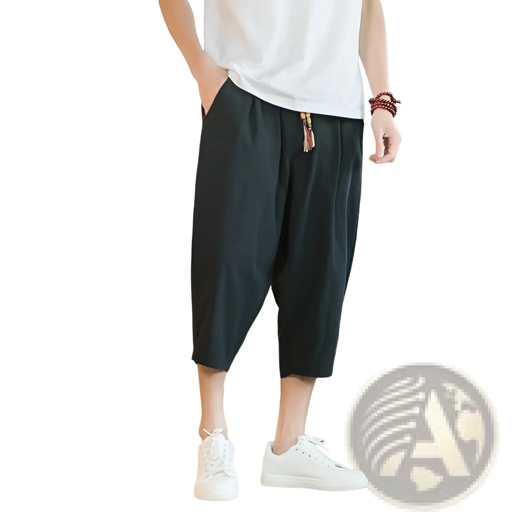 Men linen capri pants in black cotton linen with relaxed fit drawstring waist and tassel detail