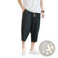 Men linen capri pants in black cotton linen with relaxed fit drawstring waist and tassel detail