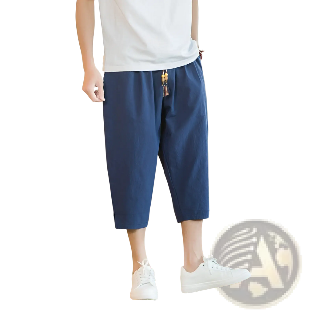 Men linen capri pants in navy blue cotton with relaxed fit and decorative tassel drawstring waistband detail