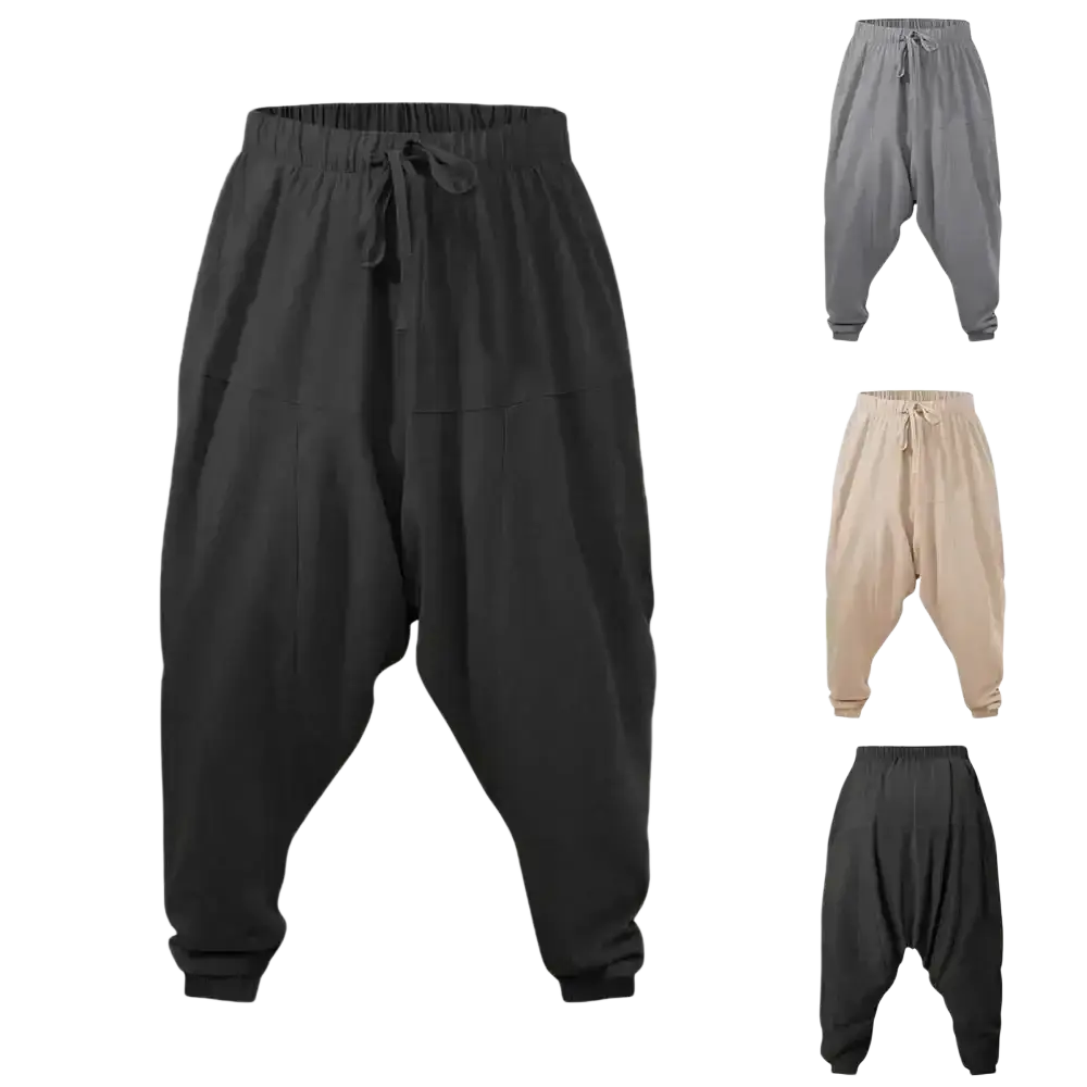 Black linen harem pants with elastic waistband and drawstring featuring a loose fit tapering to the ankles