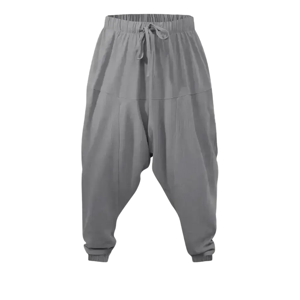 Gray linen harem pants with elastic waistband and drawstring featuring a loose fit tapered at the ankles