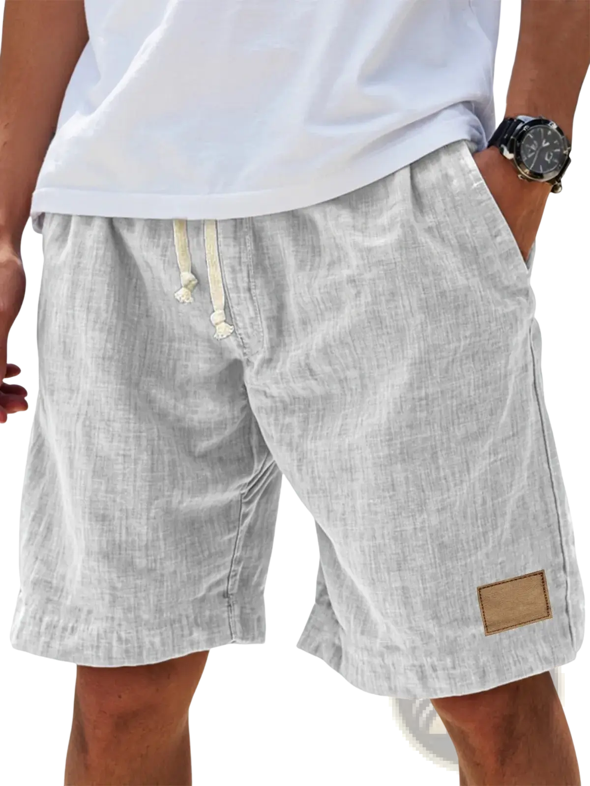 Light gray men linen holiday shorts with subtle textured weave cream drawstrings and tan leather patch on lower right leg