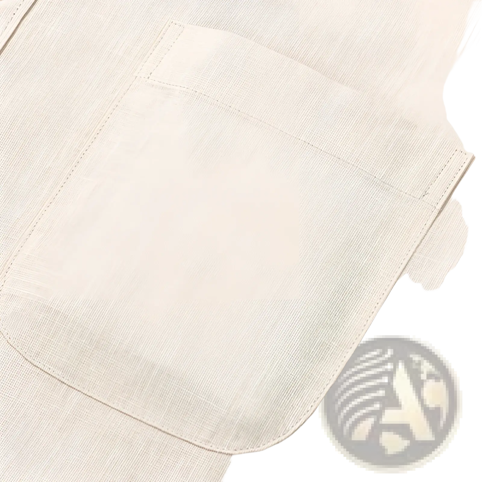 Beige linen pocket with subtle texture and neatly stitched edges on men linen mandarin collar slim shirt