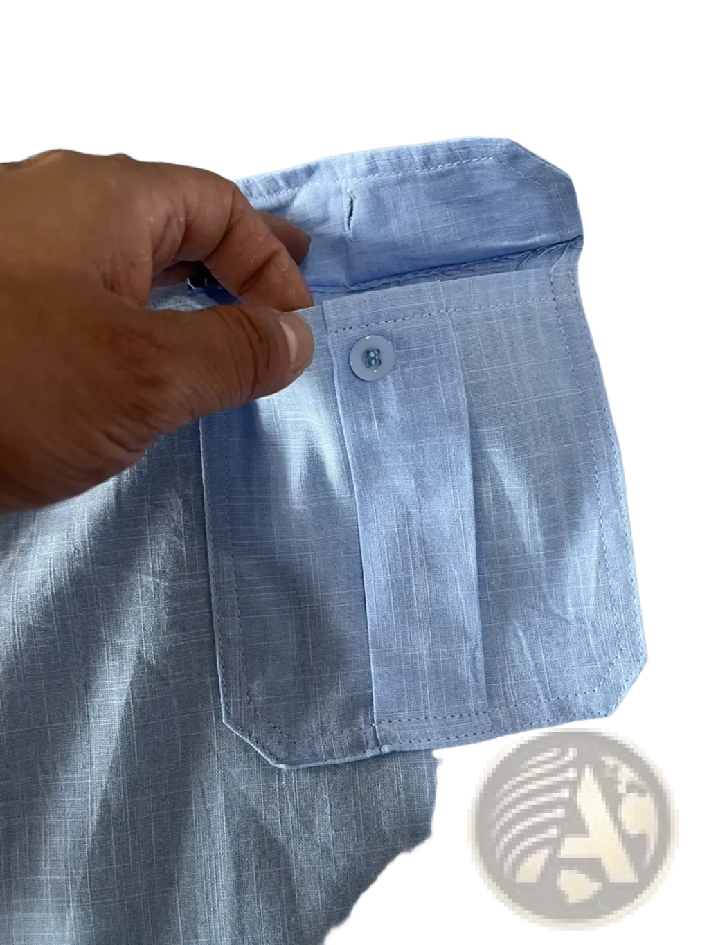 Light blue men linen short sleeve shirt with subtle woven texture and a neatly stitched double pocket for casual summer wear