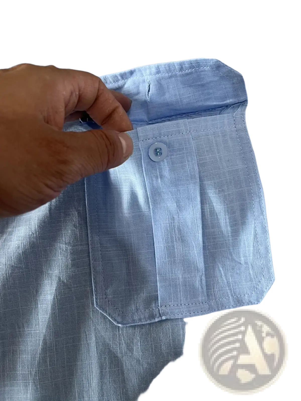 Light blue men linen short sleeve shirt with subtle woven texture and a neatly stitched double pocket for casual summer wear