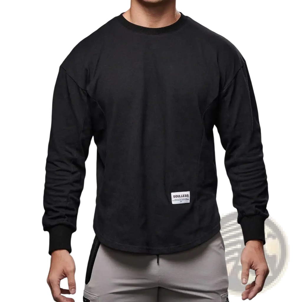 Men long sleeve cotton t shirt in black with curved hem and white rectangular label on the lower front