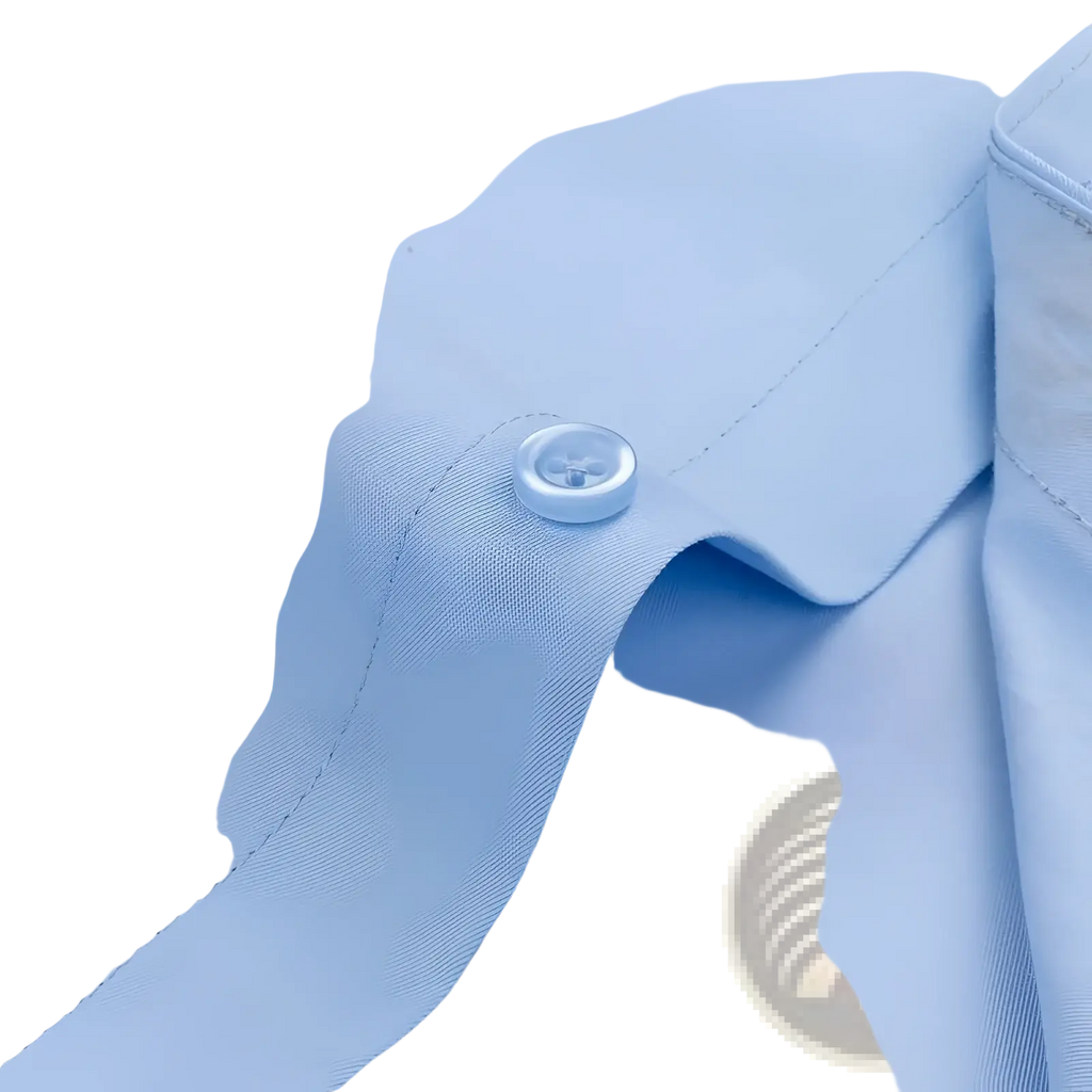 A clear round button with metallic sheen on a light blue men long sleeve dress shirt collar for formal office wear
