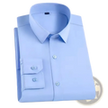 A neatly folded light blue men long sleeve formal business dress shirt with classic collar and buttoned cuffs
