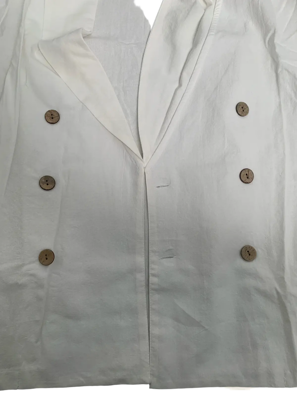 White double-breasted linen blazer with wooden buttons shown with men long sleeve linen mandarin collar casual shirt