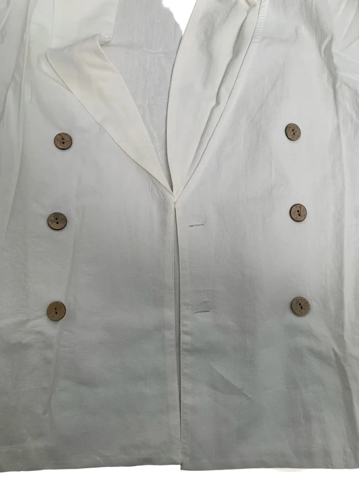 White double-breasted linen blazer with wooden buttons shown with men long sleeve linen mandarin collar casual shirt