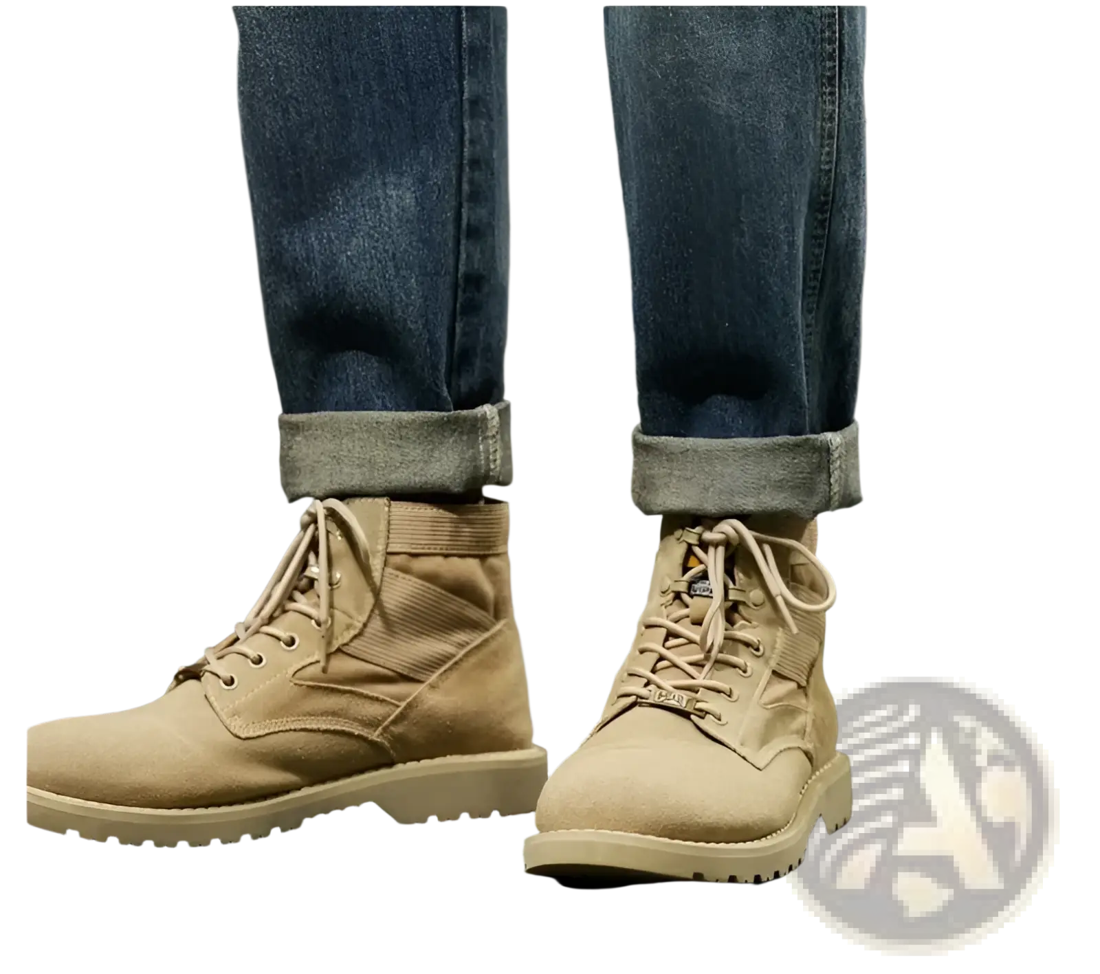 Tan suede combat boots with reinforced stitching and a rugged sole paired with men loose denim harem jeans