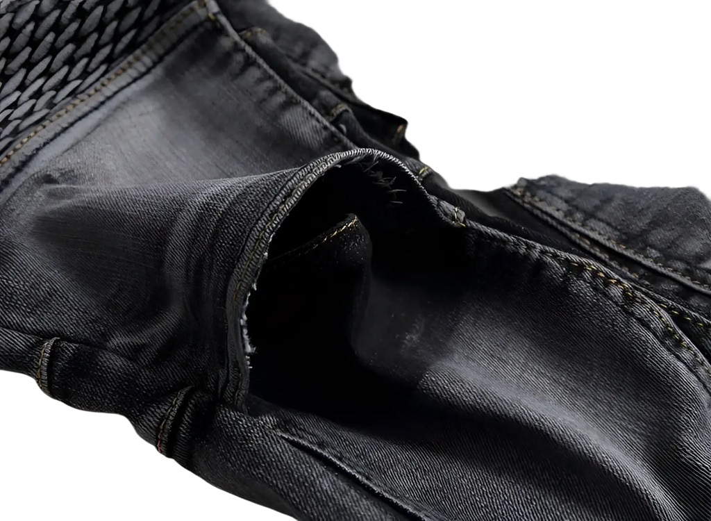Men motorcycle jeans dark-wash denim with distressed frayed back pocket edge and visible stitching slim fit trousers