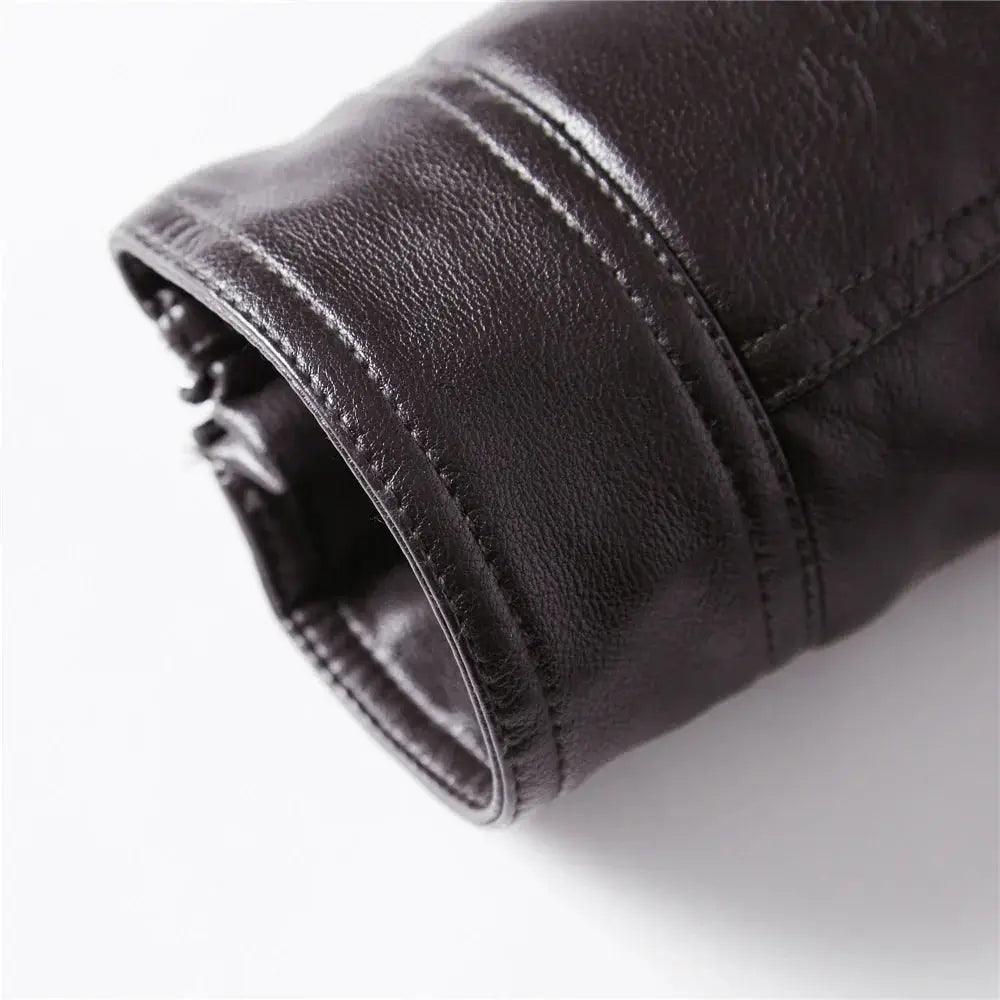 Men’s black leather motorcycle jacket cuff with red stitching fleece lining and zipper detail