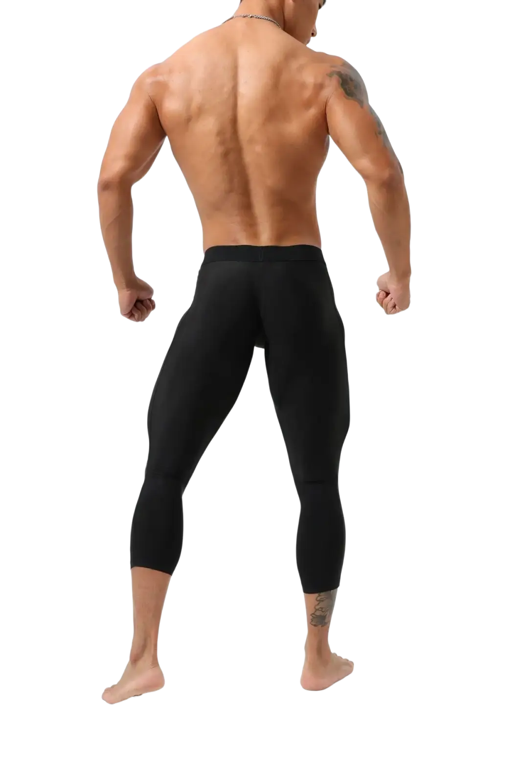 Black nylon fitness tights workout pants with smooth stretchy material contouring muscular legs