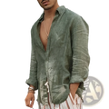 A man wearing a men olive green linen casual shirt with loose fit rolled sleeves and open front