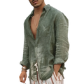 A man wearing a men olive green linen casual shirt with loose fit rolled sleeves and open front