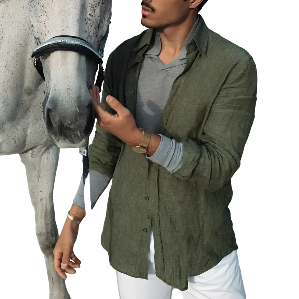Men olive green linen casual shirt with textured fabric worn over a gray polo and white pants for a stylish look