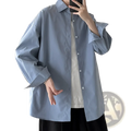 Men oversized long sleeve casual streetwear shirt in light blue featuring a classic collar and button-up front