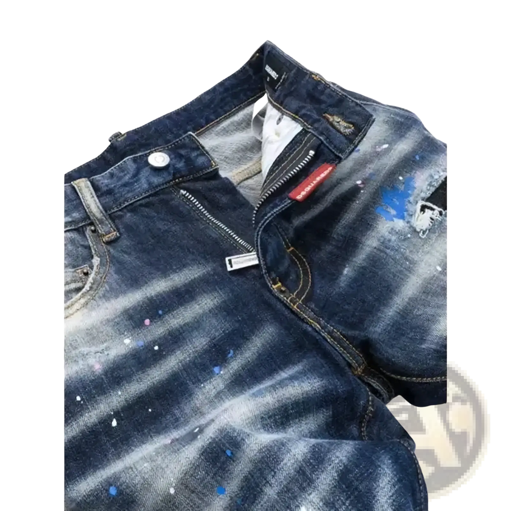Dark blue denim jeans with distressed and paint splattered design featuring white and blue splashes for men