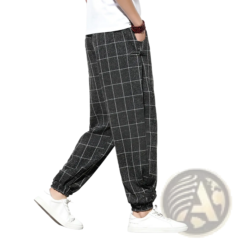 Men plaid harem pants in black and white checkered cotton with elastic cuffs for a loose casual fit