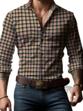A man wearing a men plaid long sleeve casual shirt with black beige and thin red intersecting lines