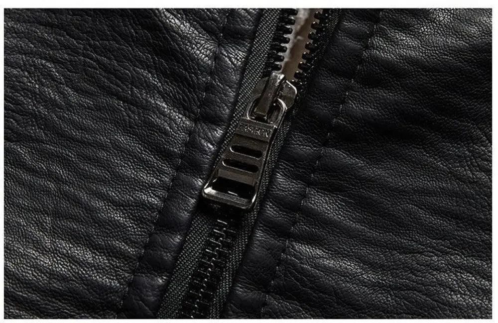 Men’s plus size black faux leather jacket zipper with metallic pull tab and plush fleece lining detail close-up