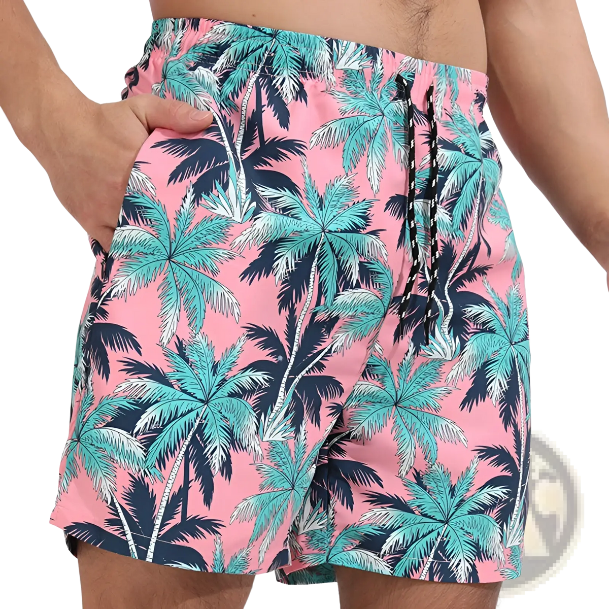 Men printed swim trunks featuring pink fabric with a vibrant tropical palm tree pattern in teal and navy blue for beach use