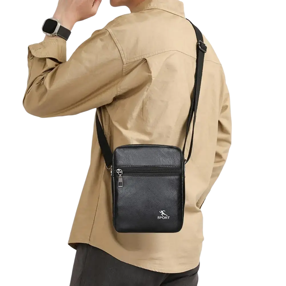 Men pu leather crossbody messenger bag in black with textured surface, silver zipper, and small white sport logo