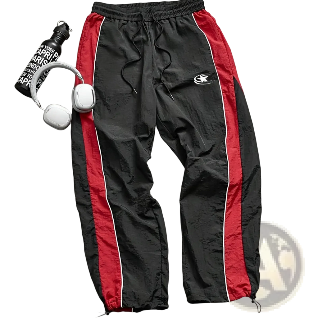 Men quick dry athletic track pants in black and red with white piping, drawstring waistband, and elastic cuffs
