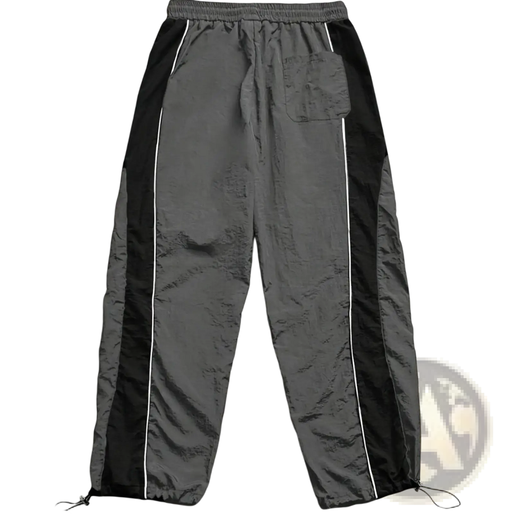 Men quick dry athletic track pants in gray with black side panels white piping drawstring waistband and adjustable cuffs