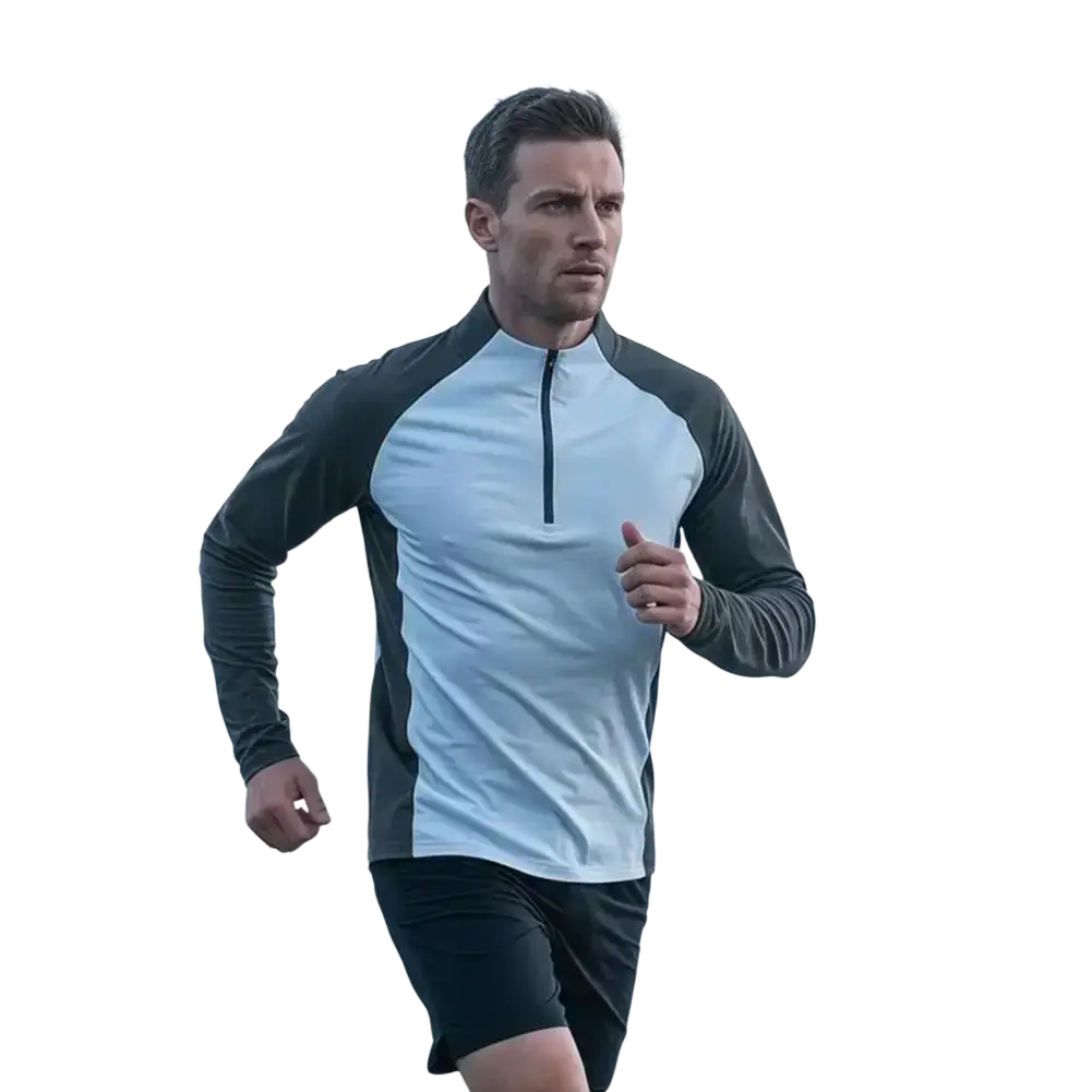 A man wearing a light blue and dark gray quick dry long sleeve active top with a half-zip collar