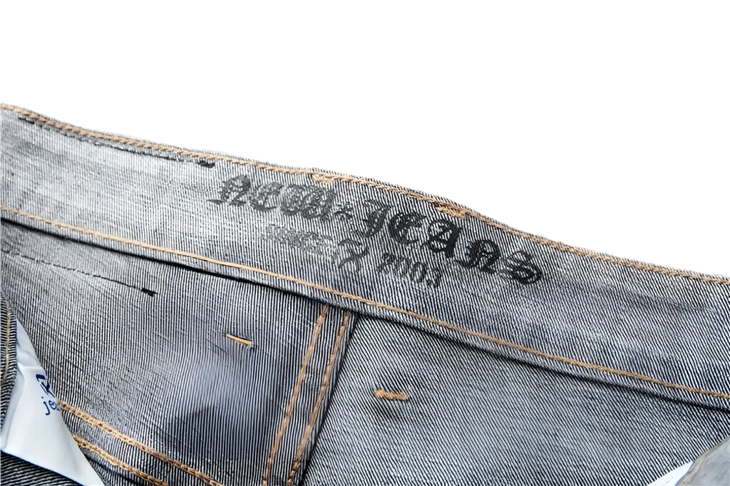 Men regular fit stretch denim jeans in grey with faded wash and brown stitching featuring jeans brand label embroidery