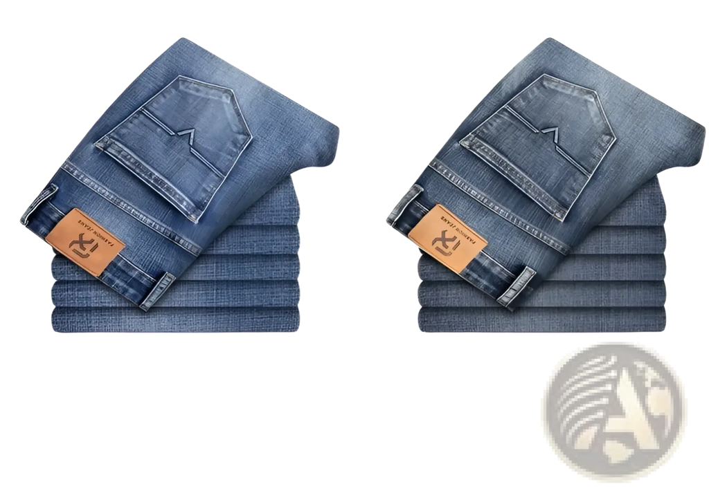 A pair of folded men regular fit stretch denim jeans in light blue and blue gray with brown leather patches