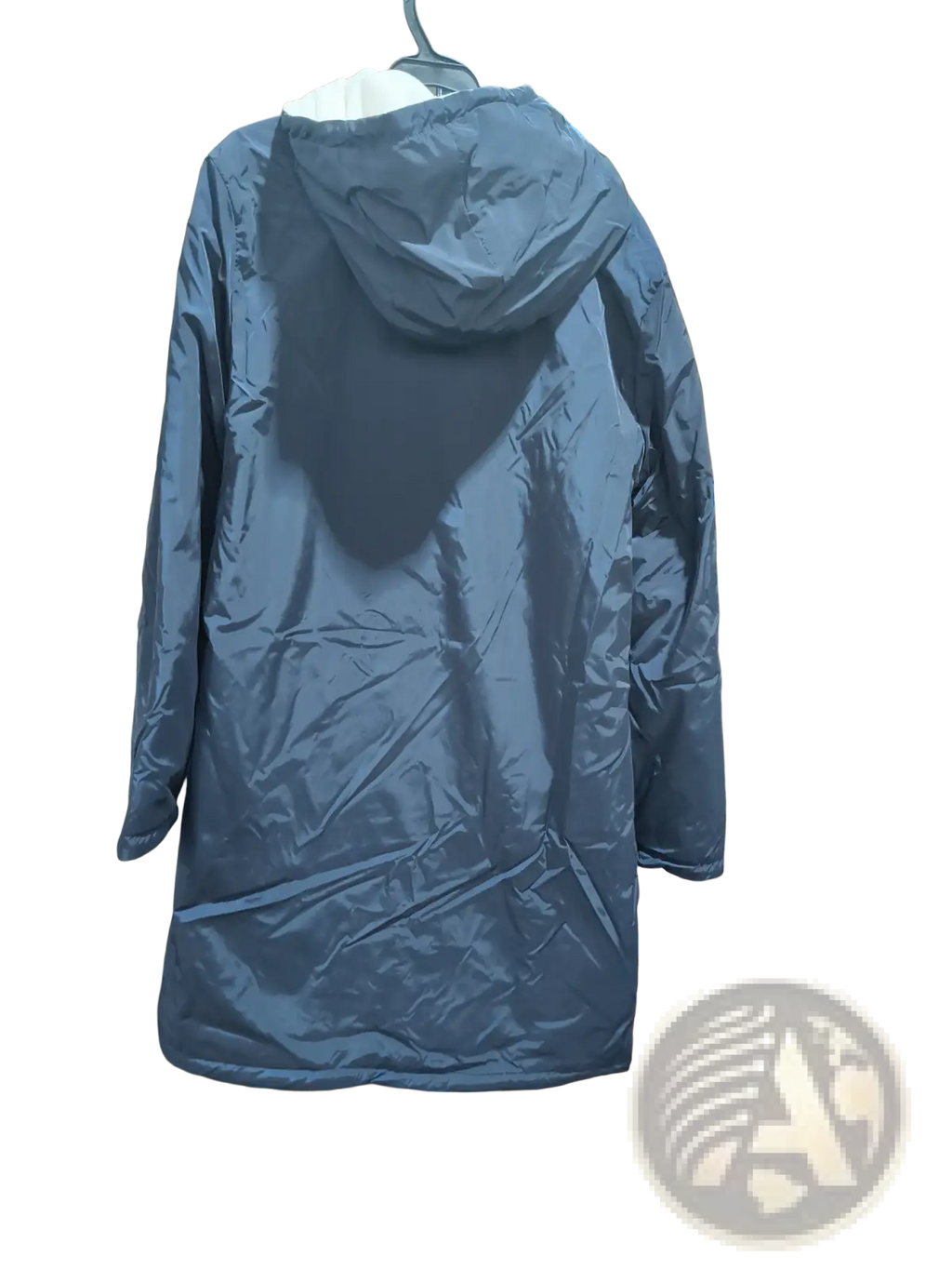 Men reversible shearling winter hooded coat shown as dark blue quilted puffer jacket with hood hanging on rack