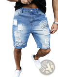 Men ripped denim shorts in blue distressed style with white graffiti print and ripped patches for summer wear