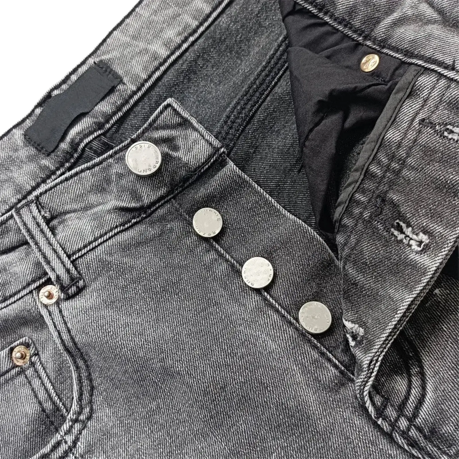 Dark gray denim men ripped skinny jeans with silver metal buttons and slightly distressed texture