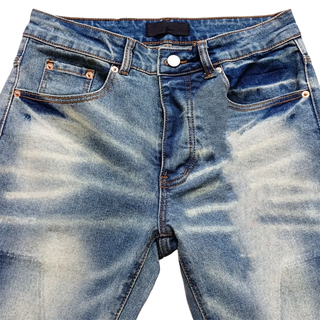 Men ripped skinny jeans in blue denim with faded distressed wash and copper-colored stitching front view