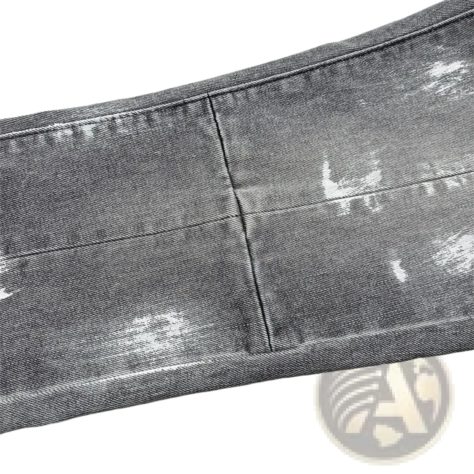 Men ripped skinny jeans in distressed gray denim with faded worn-in look and subtle white paint splatter accents