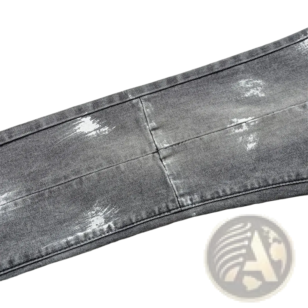 Men ripped skinny jeans in distressed gray denim with faded wash and subtle white paint splatter accents