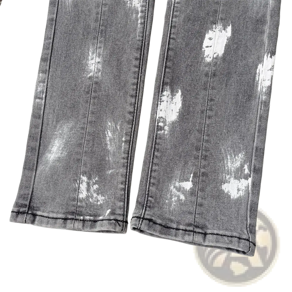 Men ripped skinny jeans in distressed gray denim with faded whitewashed pattern and visible stitching
