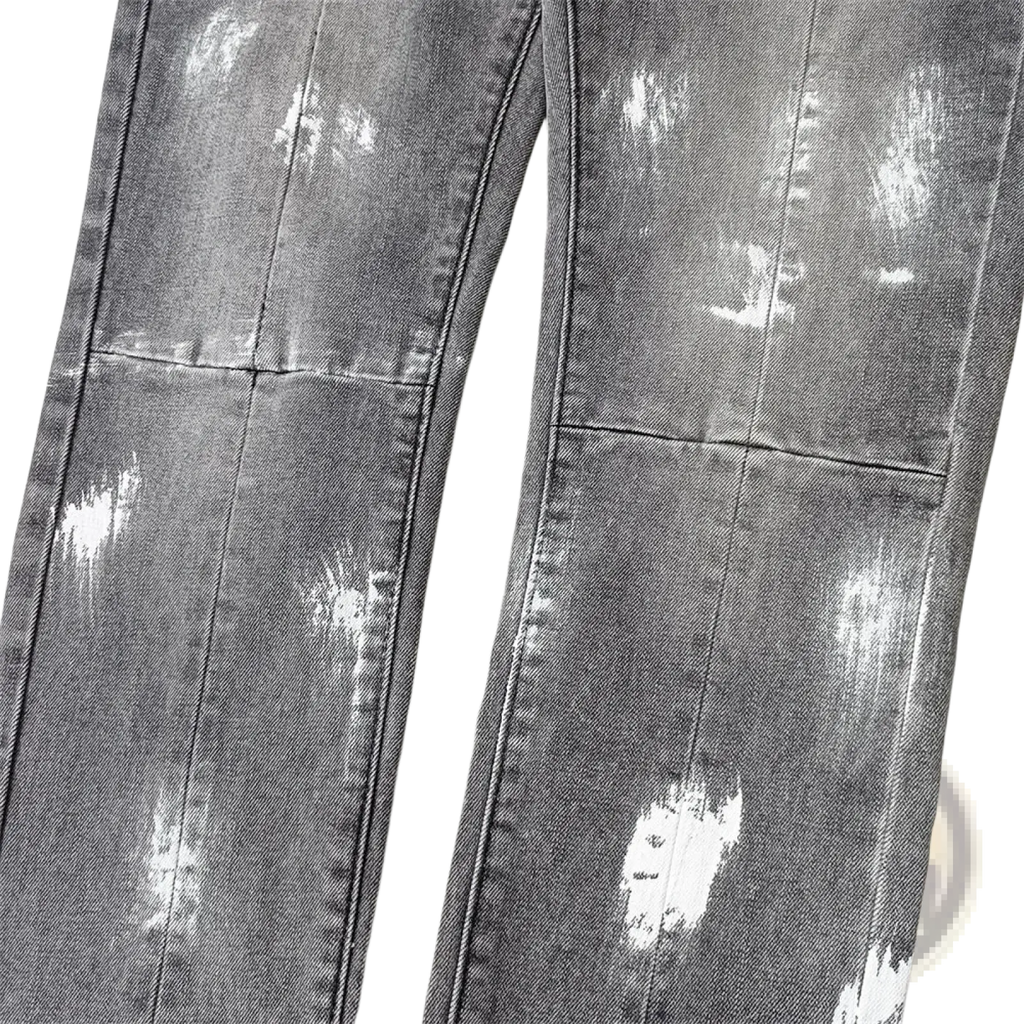 Men ripped skinny jeans in distressed gray denim with white paint splatter effects and retro wash blue tones
