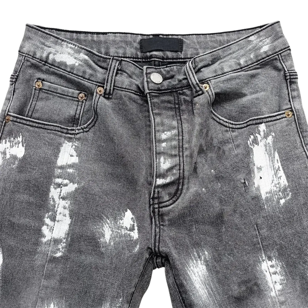 Men ripped skinny jeans in distressed gray denim with white paint splatter and gold-tone hardware details