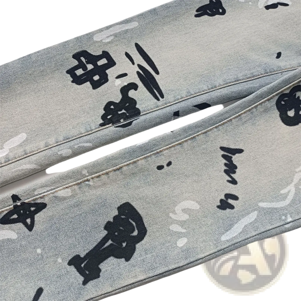 Men ripped skinny jeans in light-wash denim with bold black graffiti-style graphic print and distressed retro wash blue details