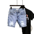 Men ripped slim fit denim shorts in light-wash with distressed ripped details and rolled cuffs made of denim material